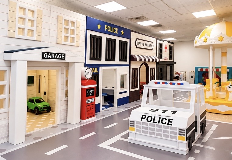 Mini main street with police station, garage, gas station and Happy Bakery