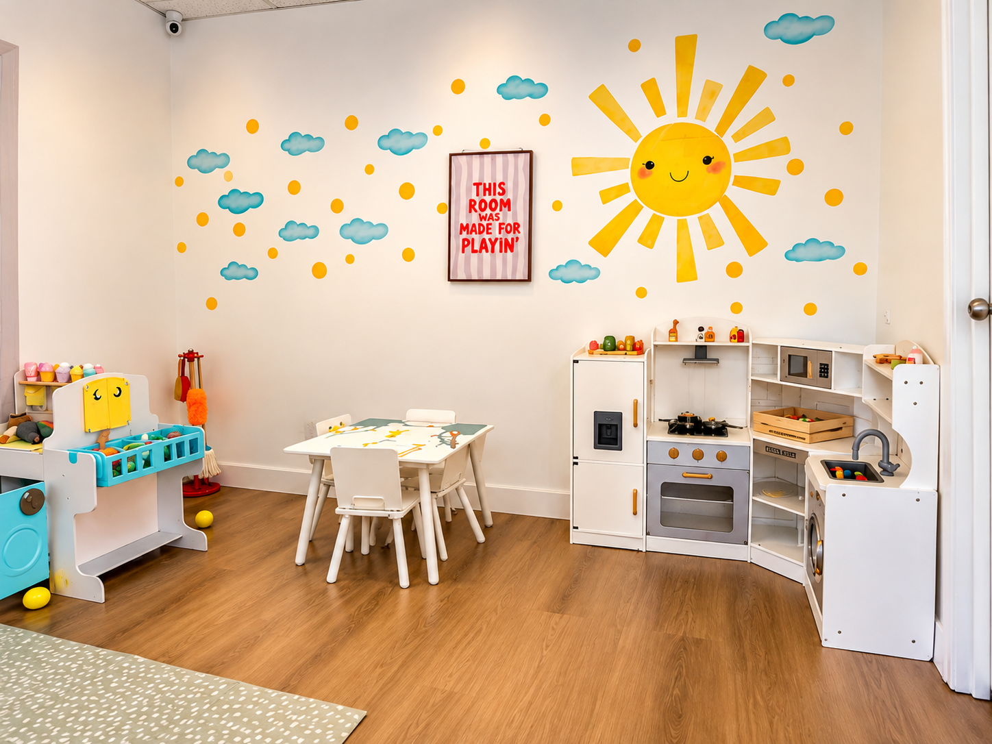 My Little Home Corner with play kitchen, craft table and 'This room was made for playin' sign